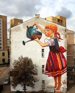 A mural of a girl watering a plant.